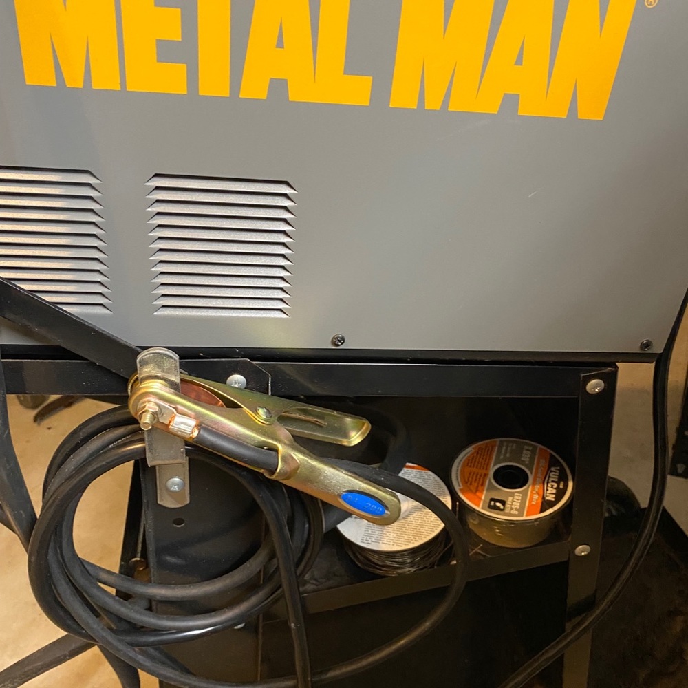 MiG Welder, rolling stand, helmets, wire all new